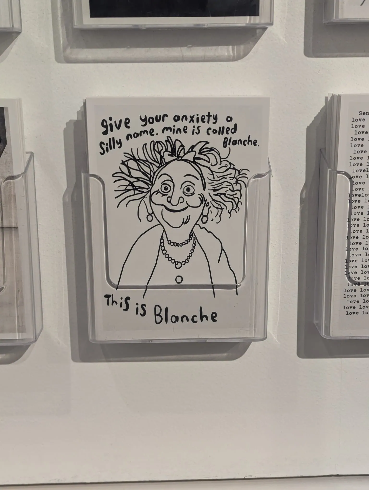 A small artwork with a cartoon face inside Moco Museum