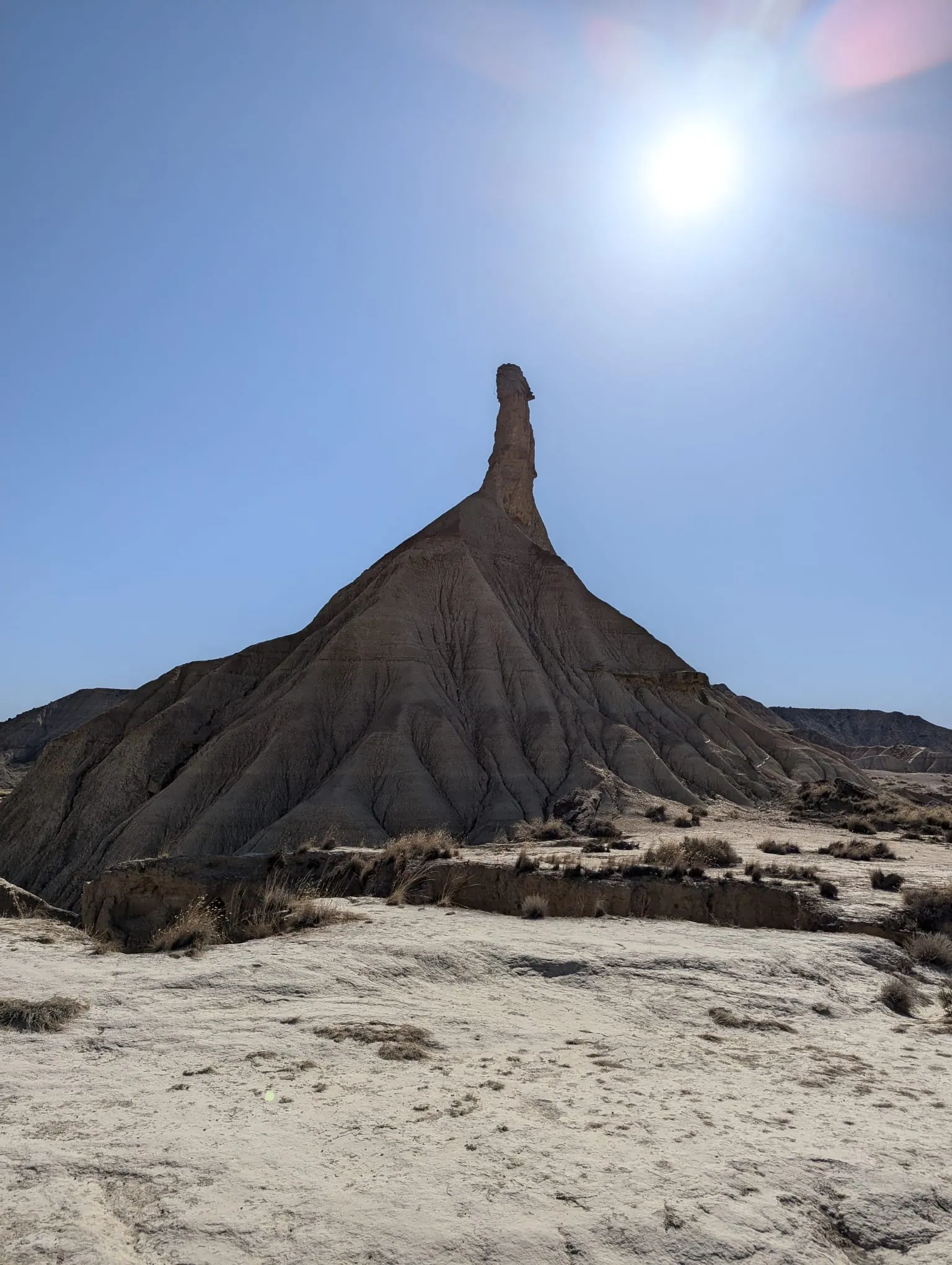 Castildetierra rock tower in Bardenas Reales with the sun above it