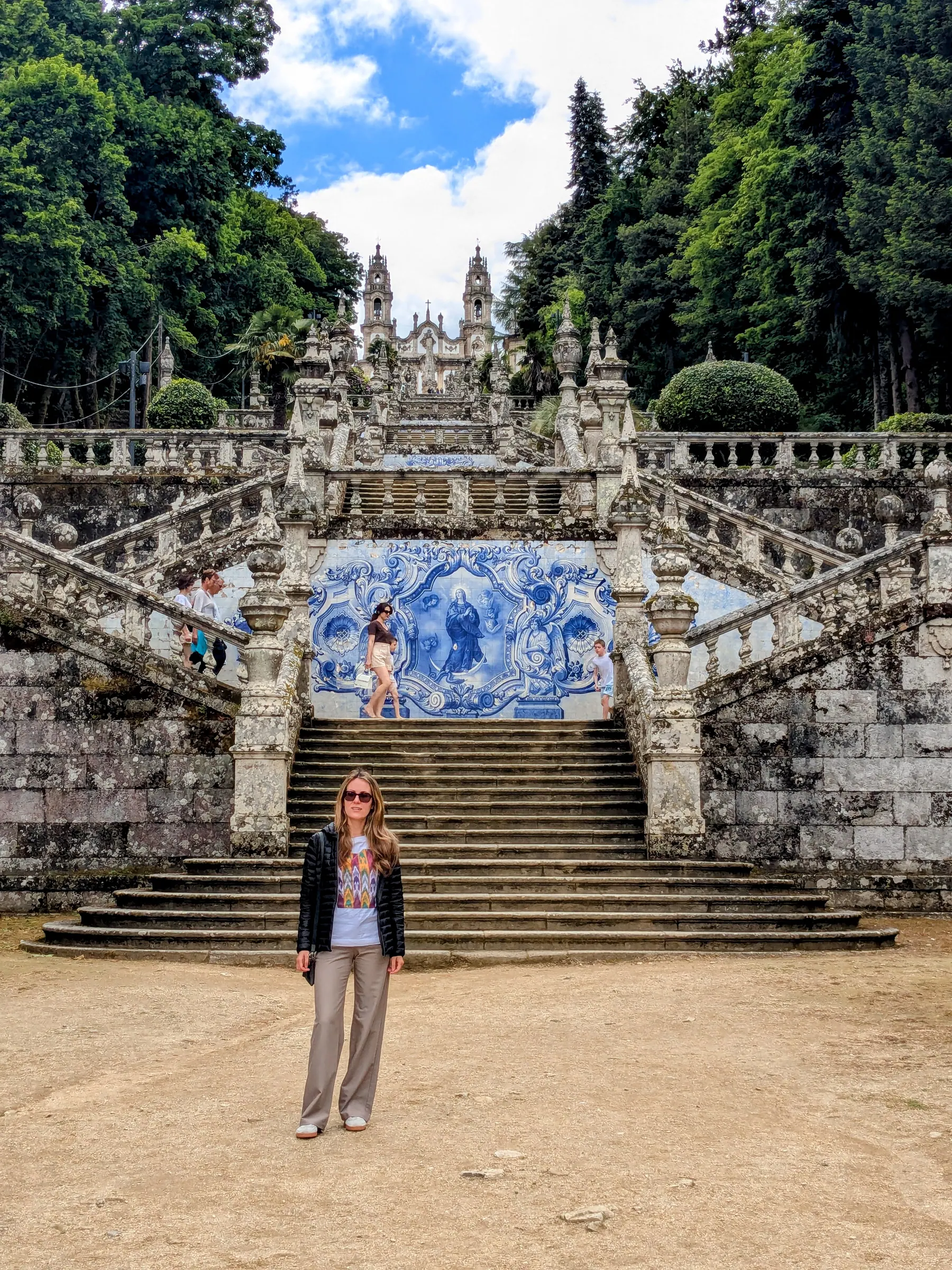 A traveler standing at the base of the Sanctuary of Nossa Senhora dos Remedios staircase in Lamego