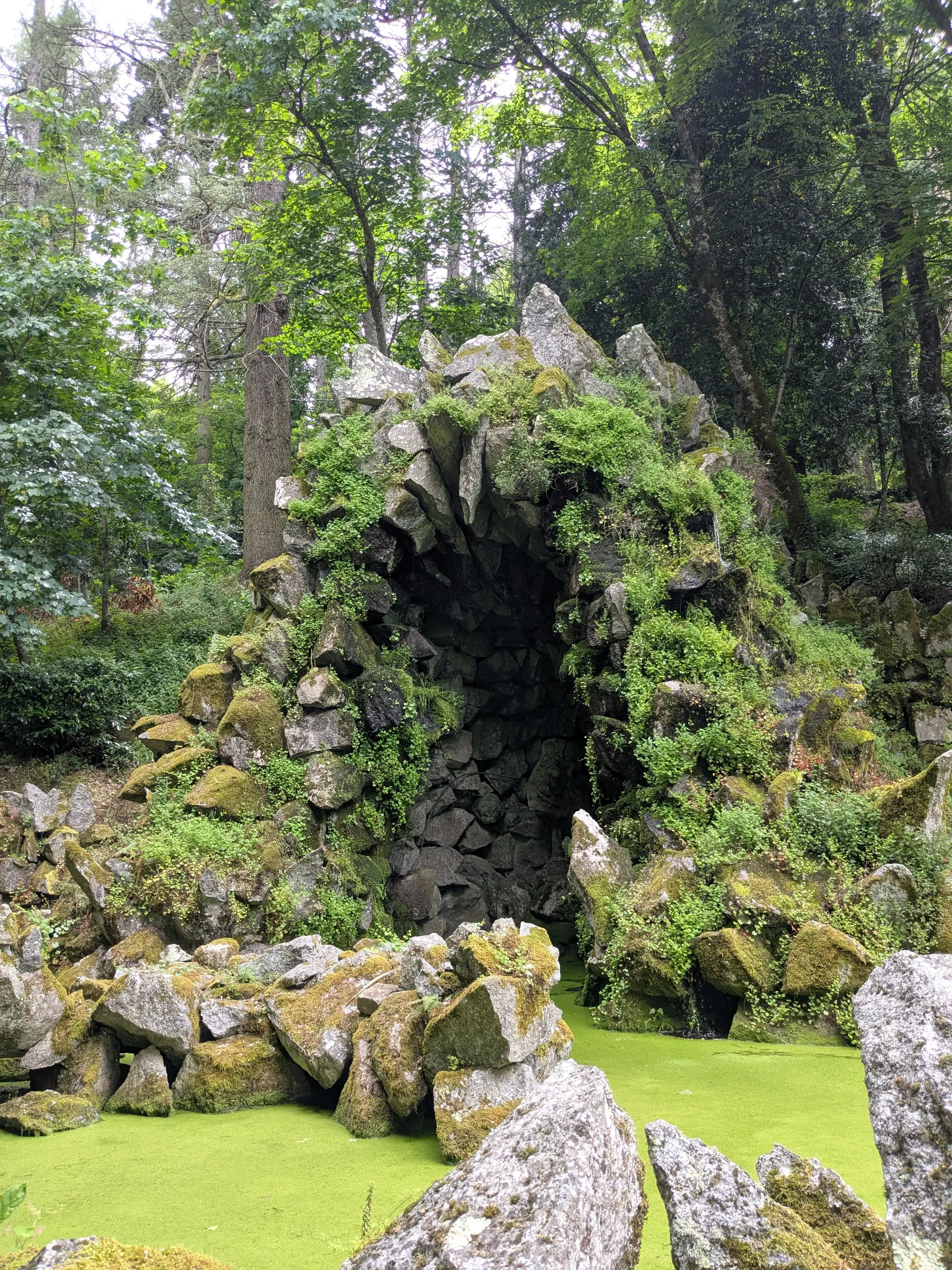 A mossy stone grotto in the gardens of the Sanctuary of Nossa Senhora dos Remedios