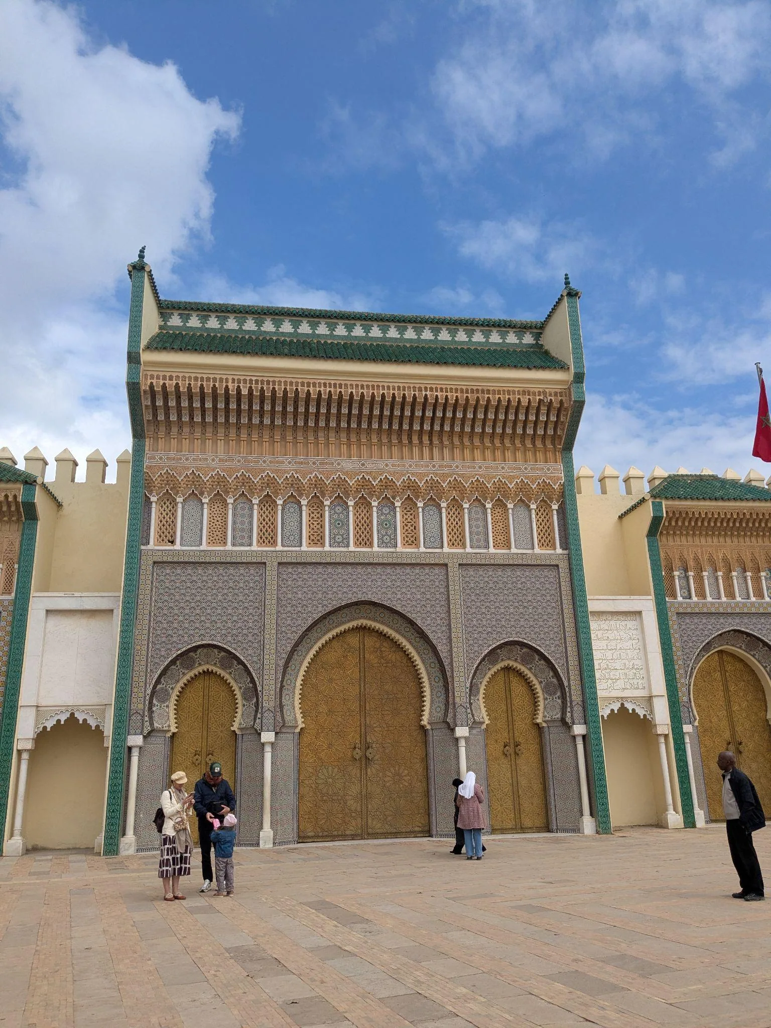 The ornate golden gates of the Royal Palace of Fez