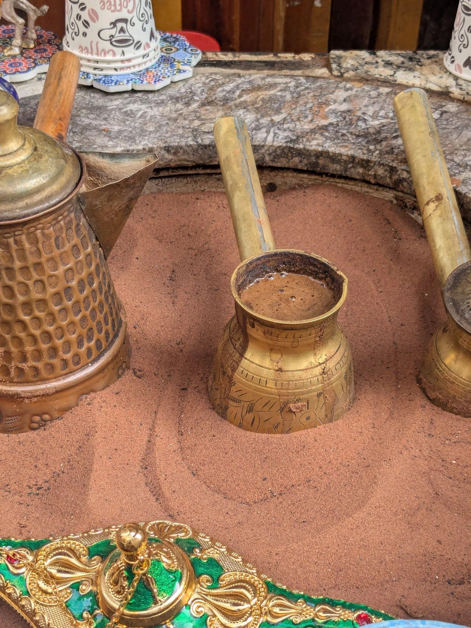 Traditional coffee pots at a street vendor in the Fez medina