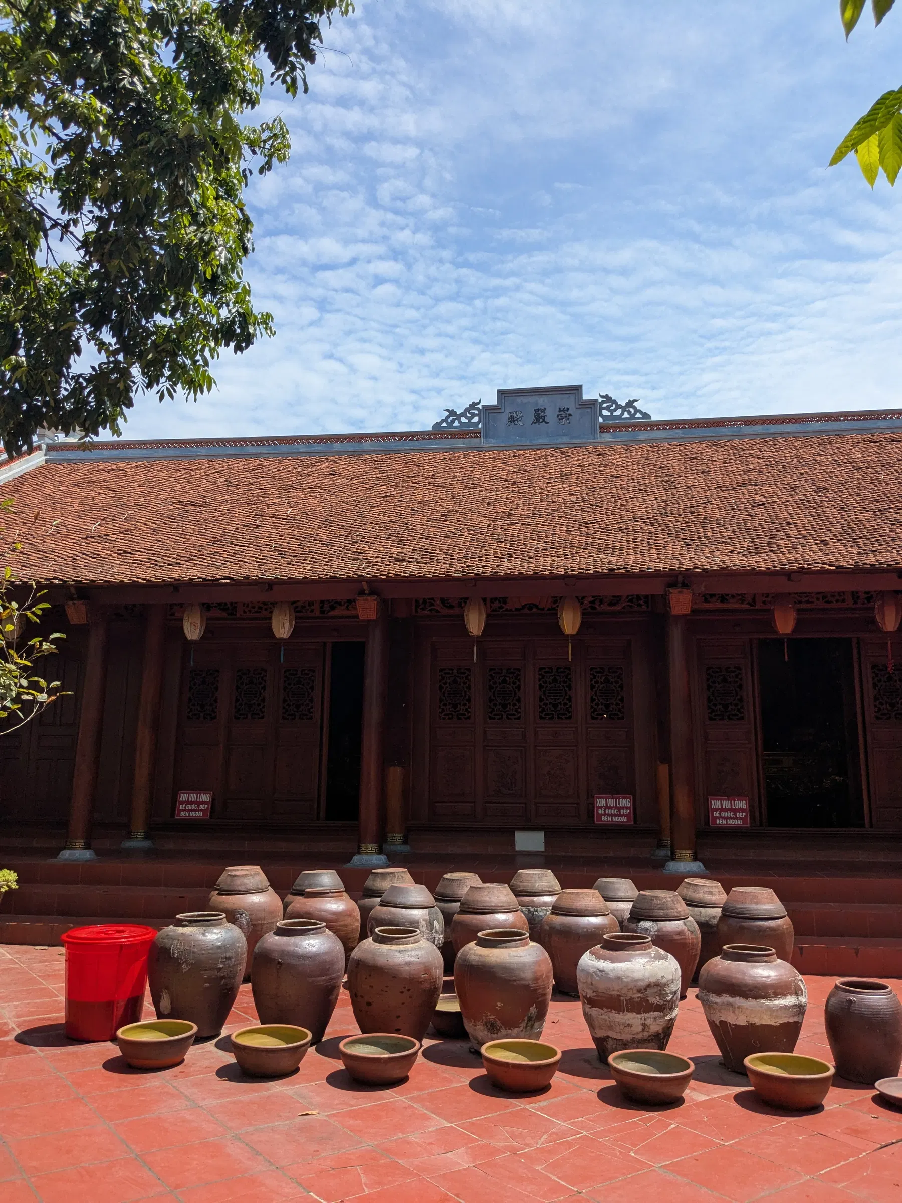 Rows of earthenware jars outside an old house in Đường Lâm village