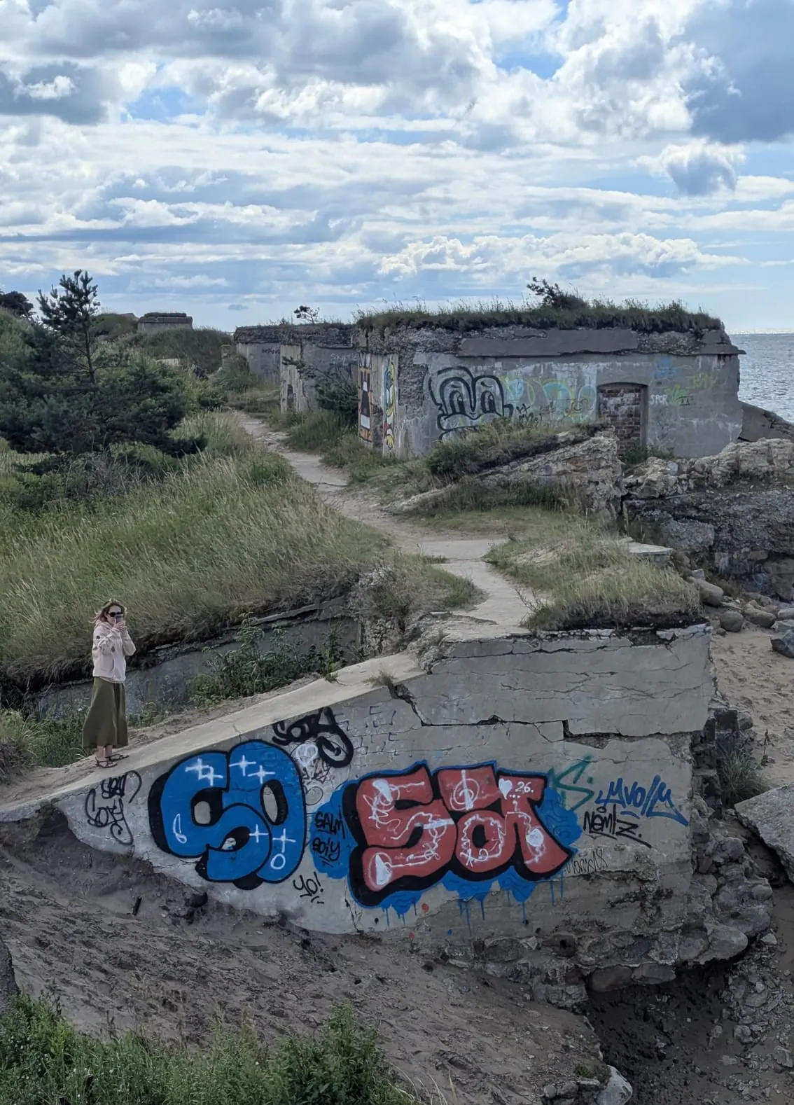 Graffiti-covered ruins of Artillery Battery No. 1 beside the Baltic Sea