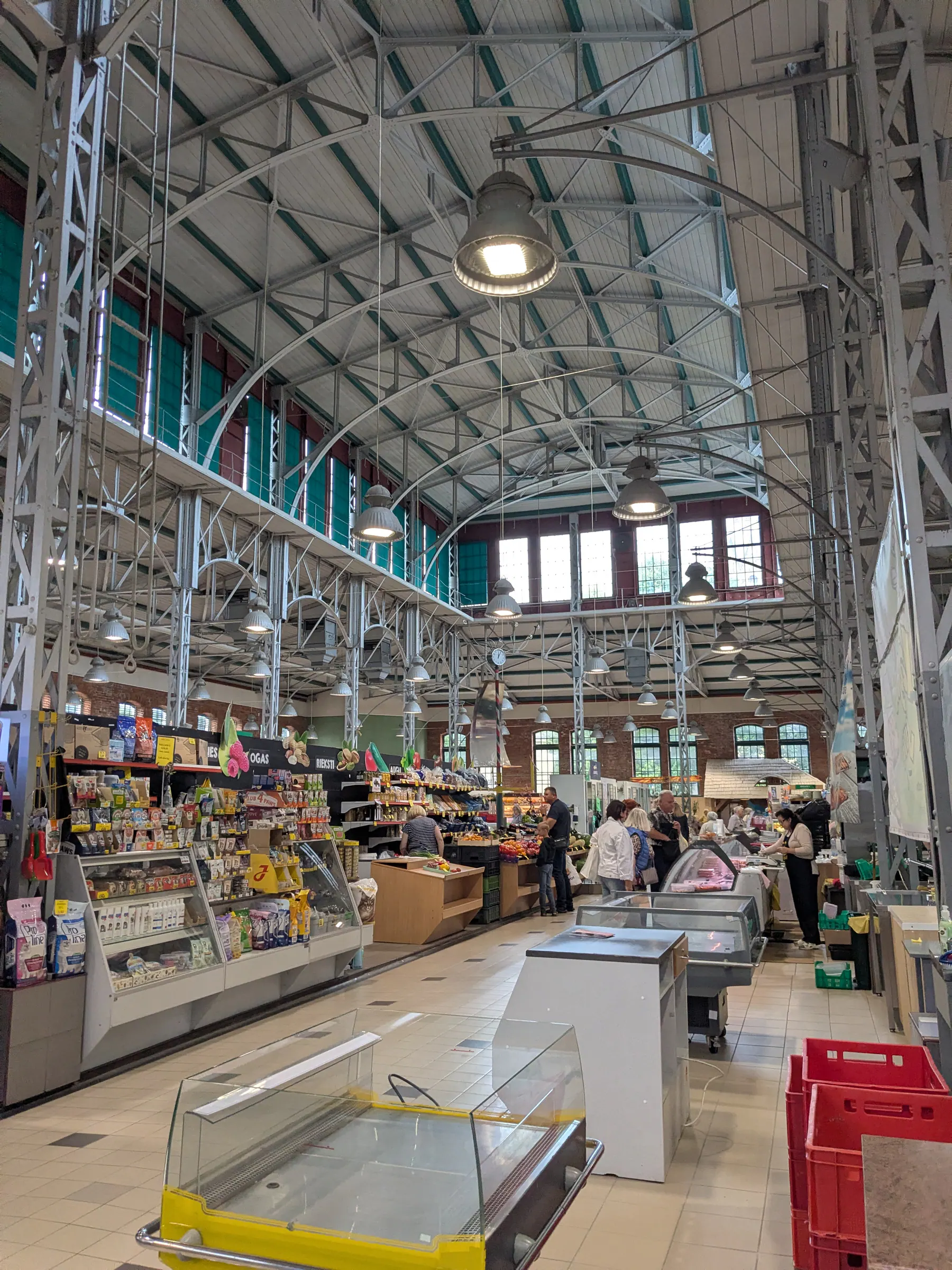 Produce stalls beneath the renovated iron roof inside Peter's Market