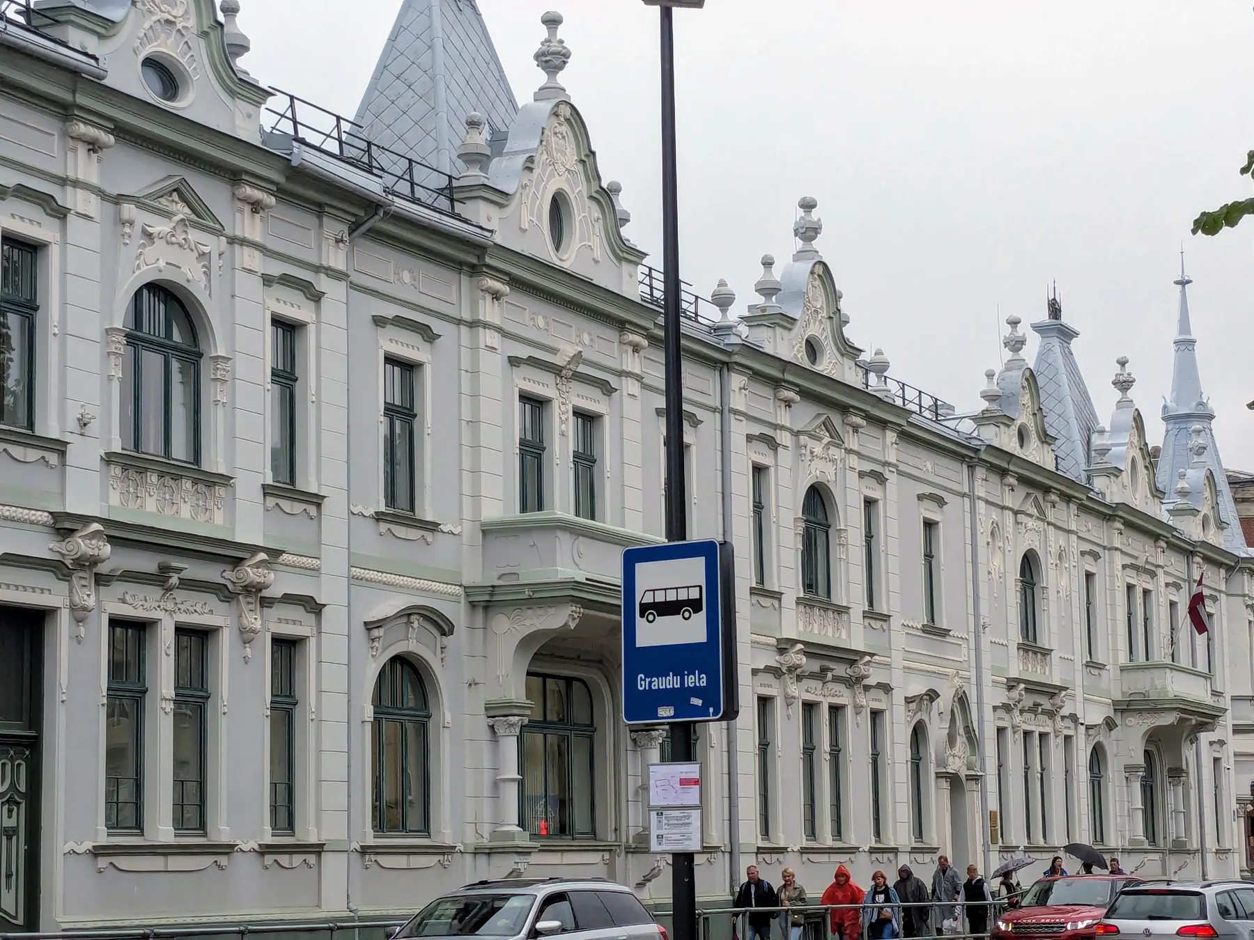The decorative white façade of an Art Nouveau building in Liepāja