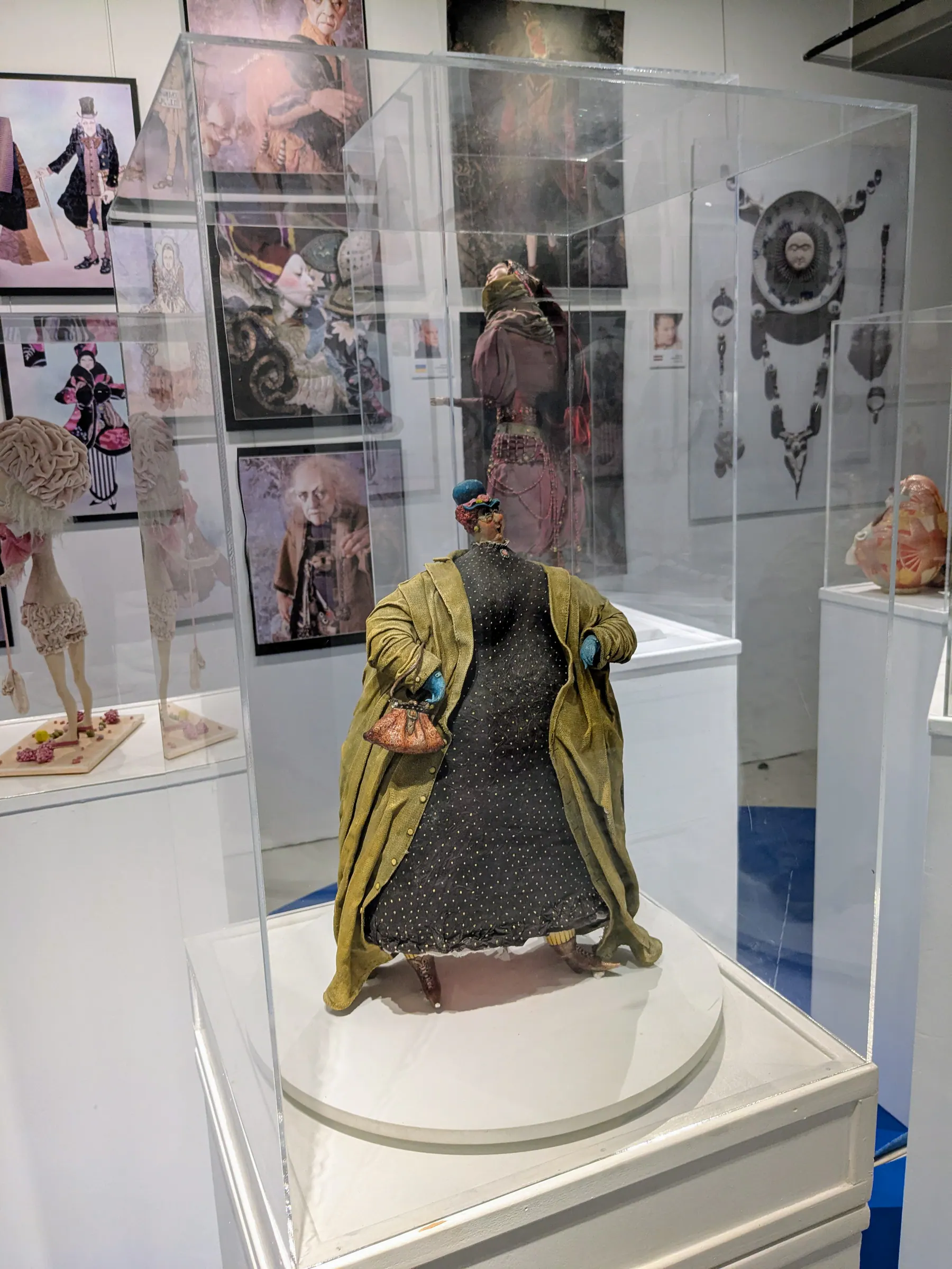 A vintage doll displayed at Galerija Romas dārzs