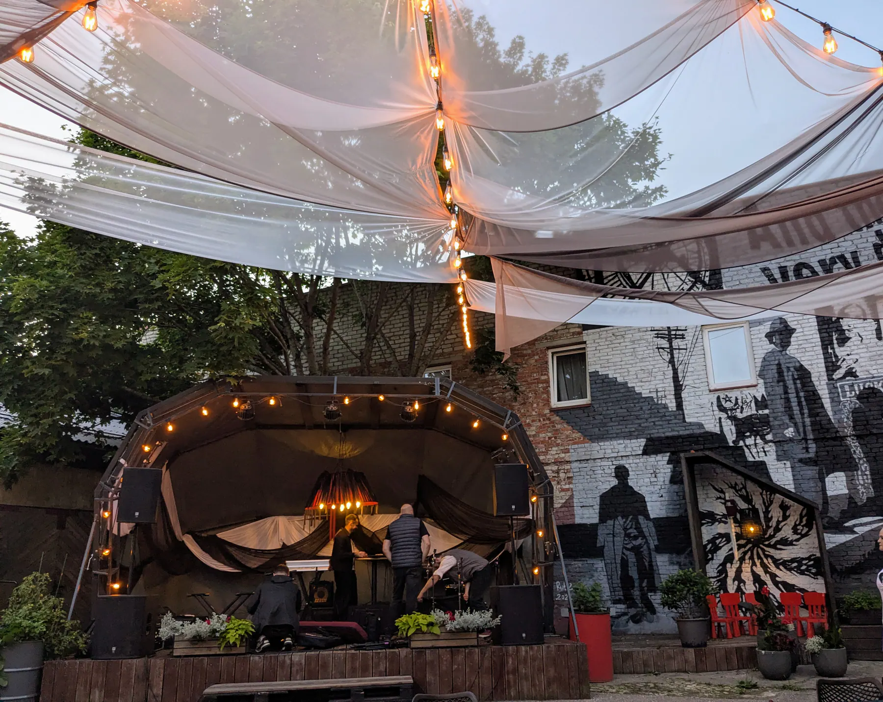 The covered stage and courtyard at Pegaza pagalms