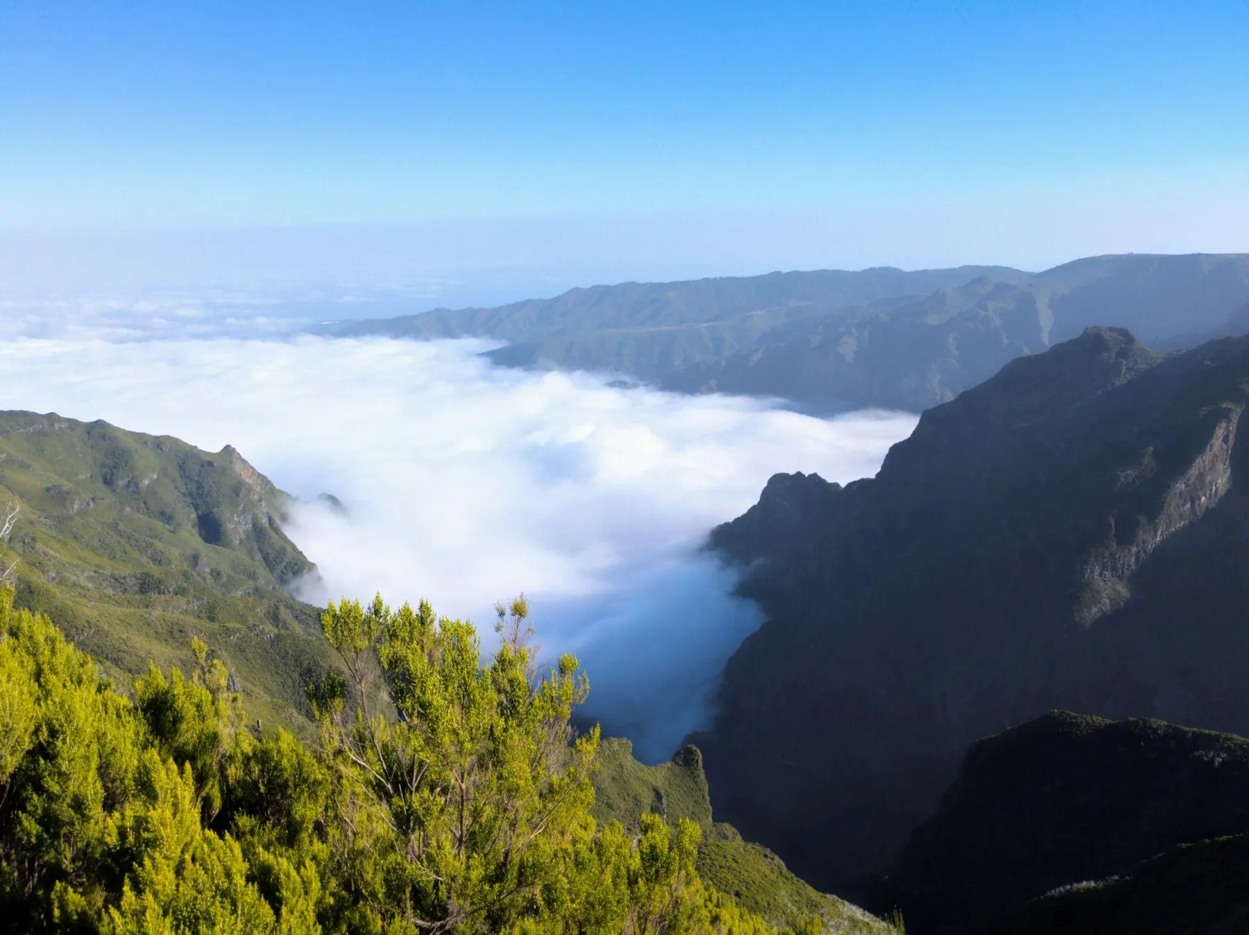 Mountain valley in Madeira with clouds sitting below the peaks