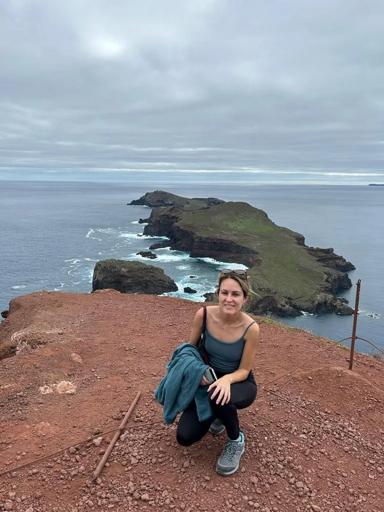 A traveler sitting above the Atlantic at Ponta de São Lourenço