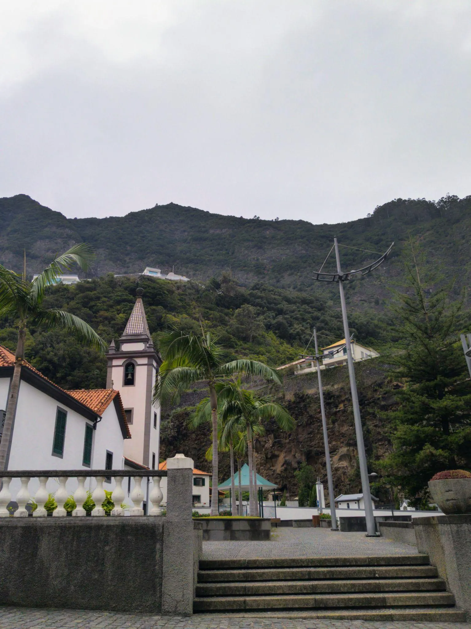 Church and green mountains in São Vicente, Madeira