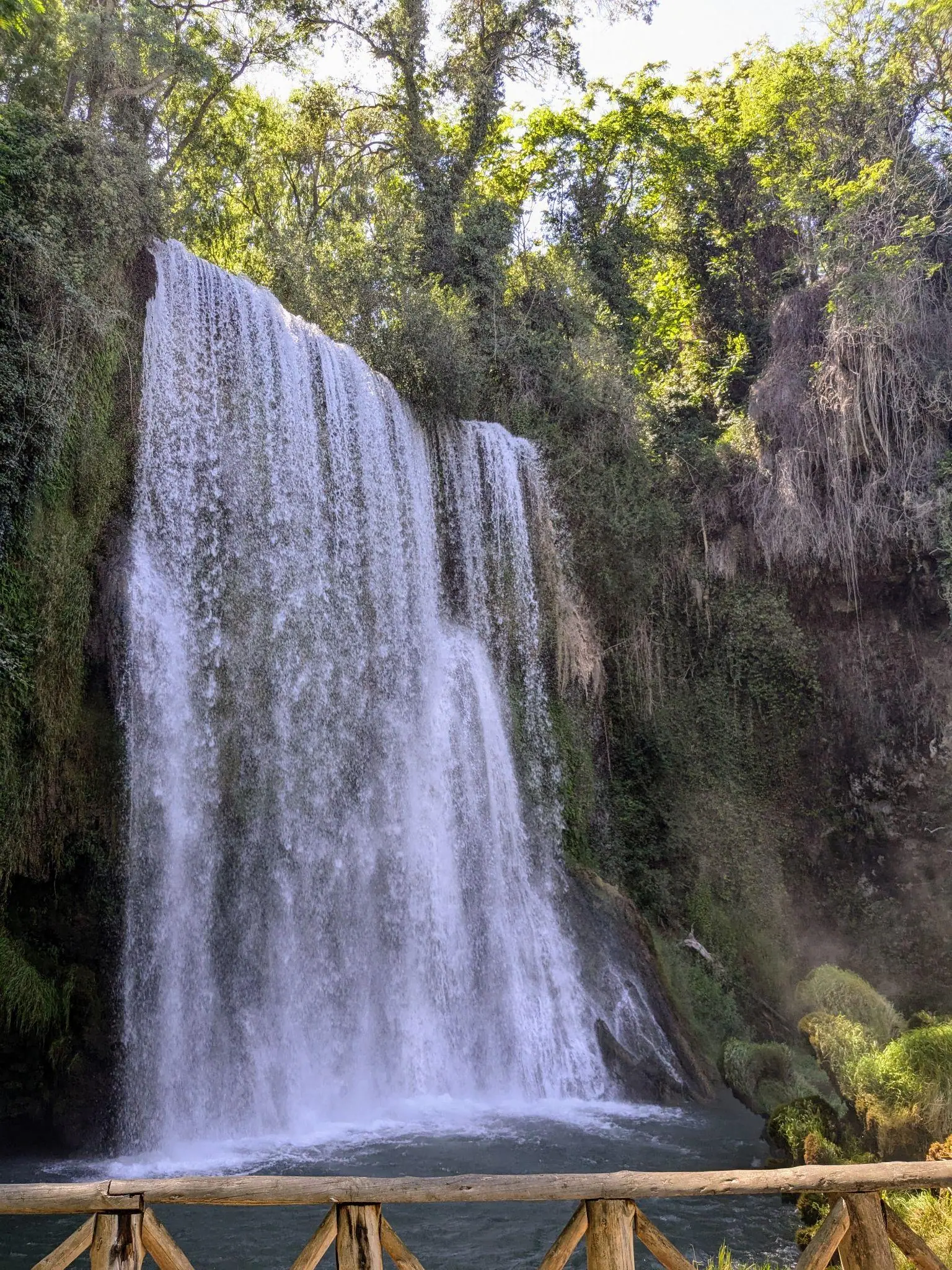 The Cola de Caballo waterfall dropping into a pool at Monasterio de Piedra