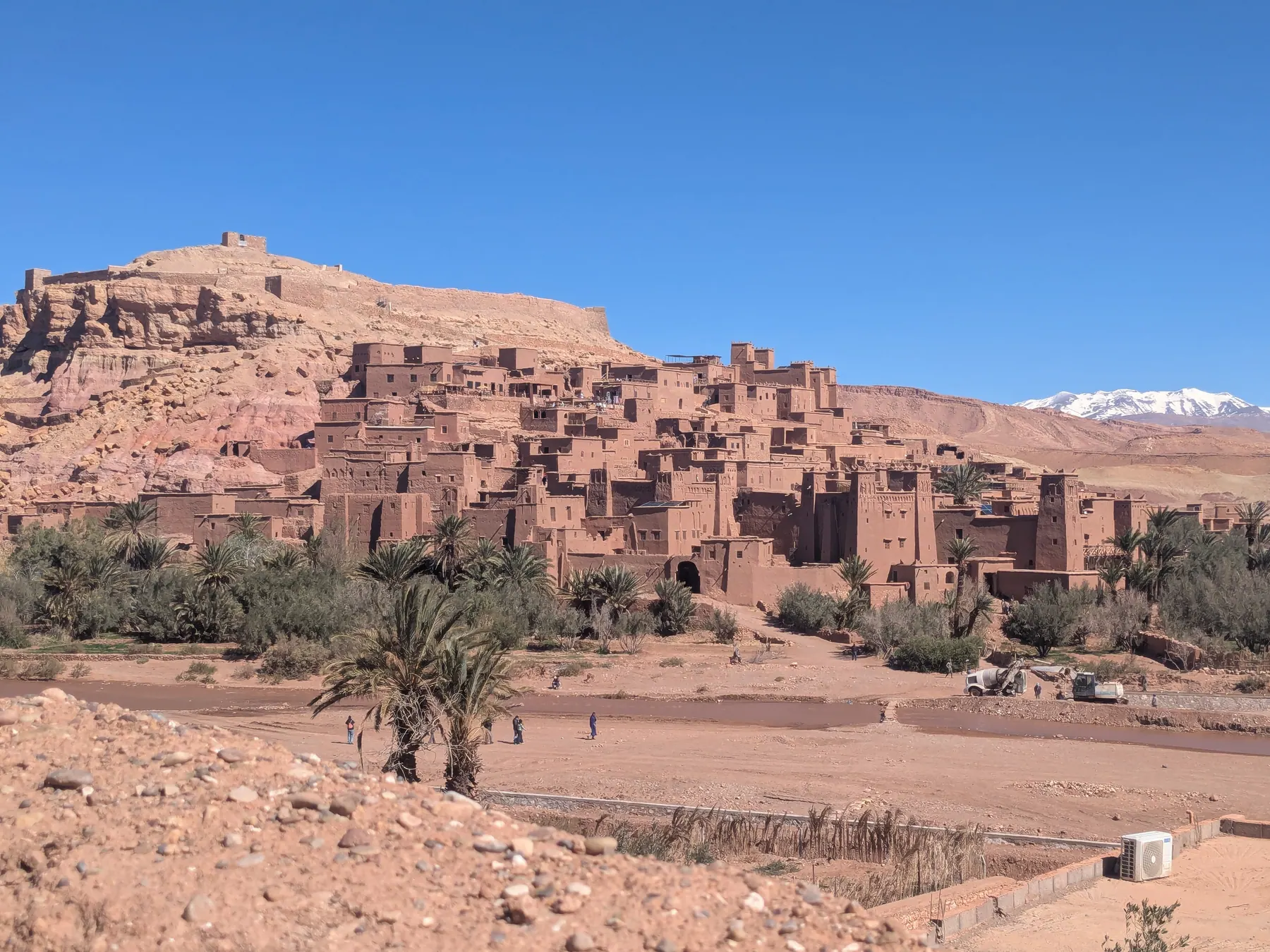 Ait Benhaddou surrounded by desert hills and distant mountains