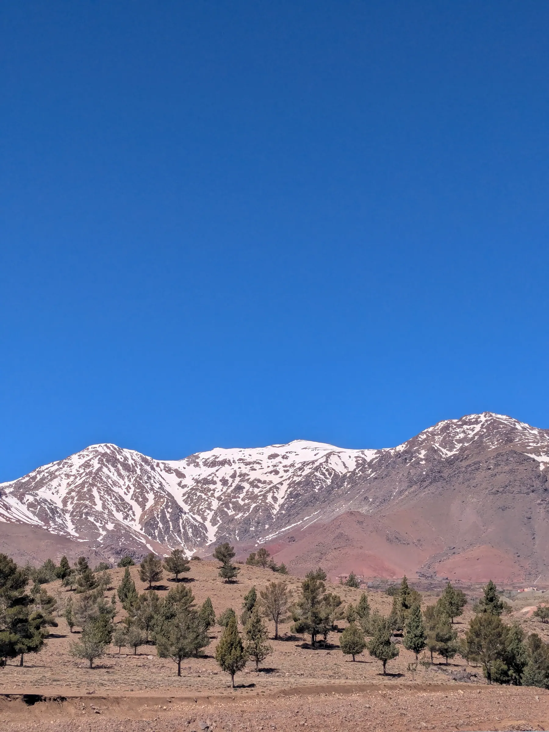 Snow-capped Atlas Mountains seen from the road in Morocco