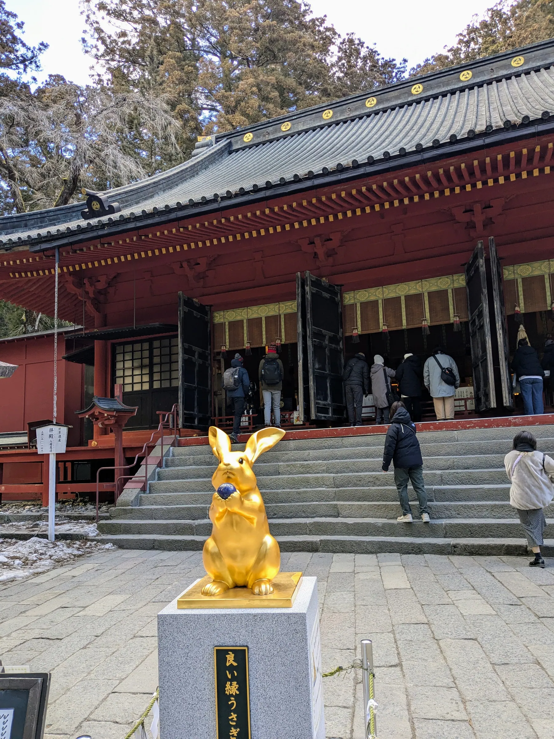 A golden rabbit statue outside a Nikko temple