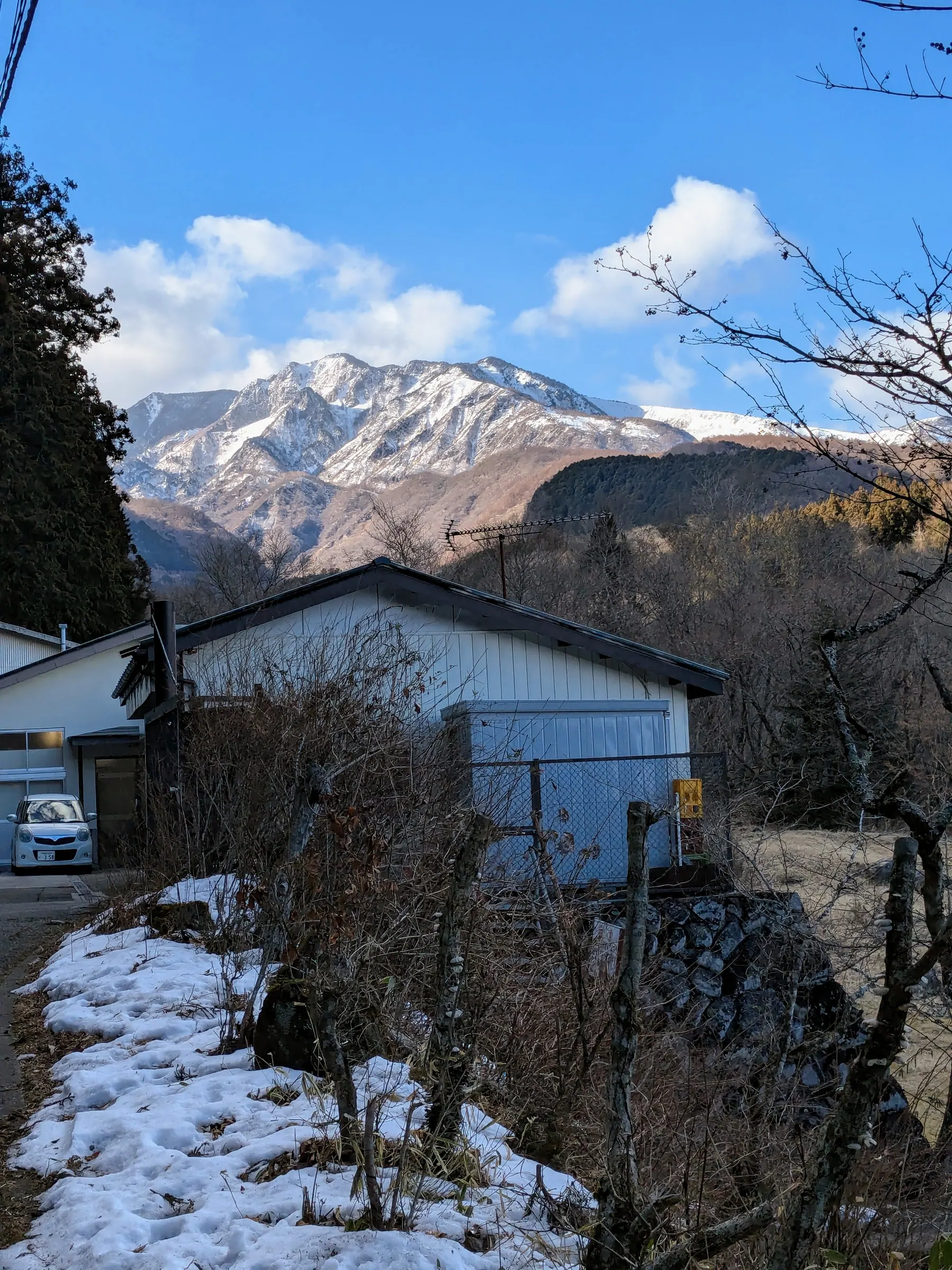 Snowy mountain landscape beyond Nikko's temple area