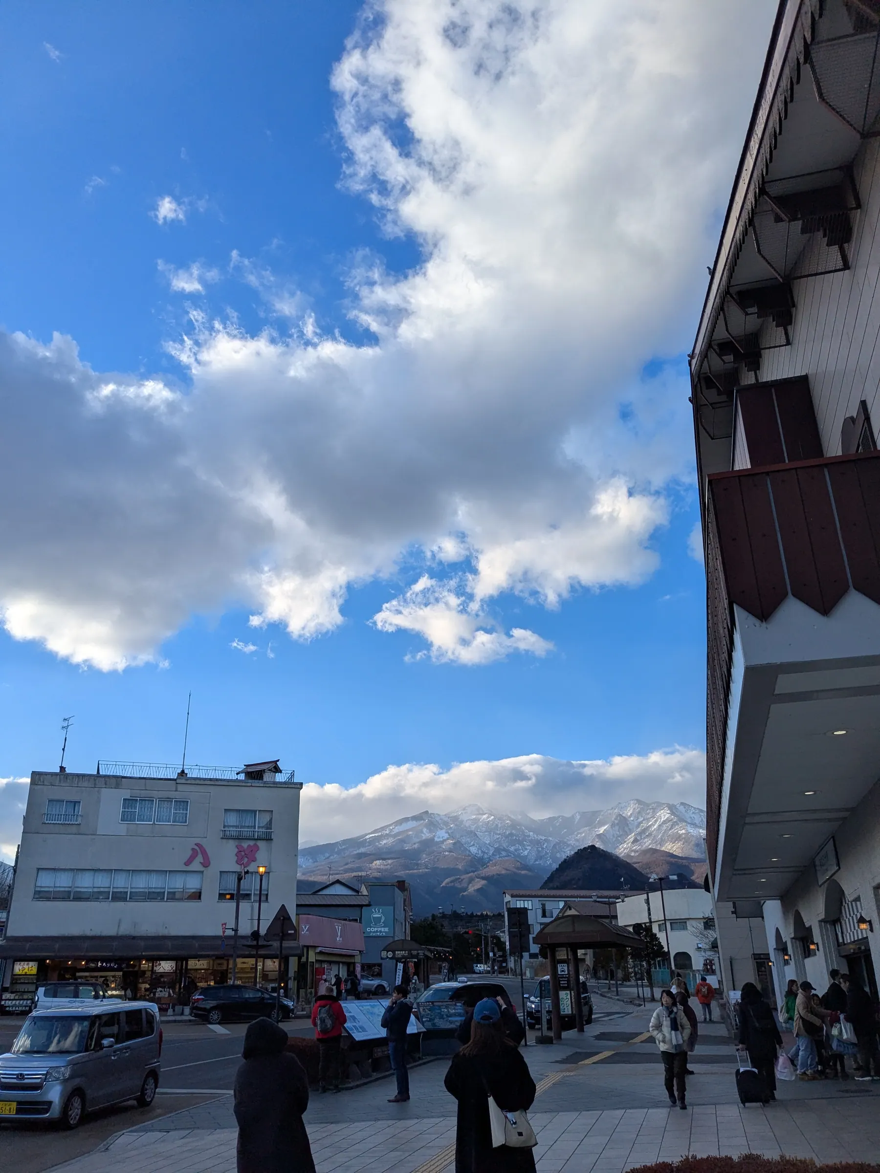 Nikko street with snowy mountains after arriving in winter
