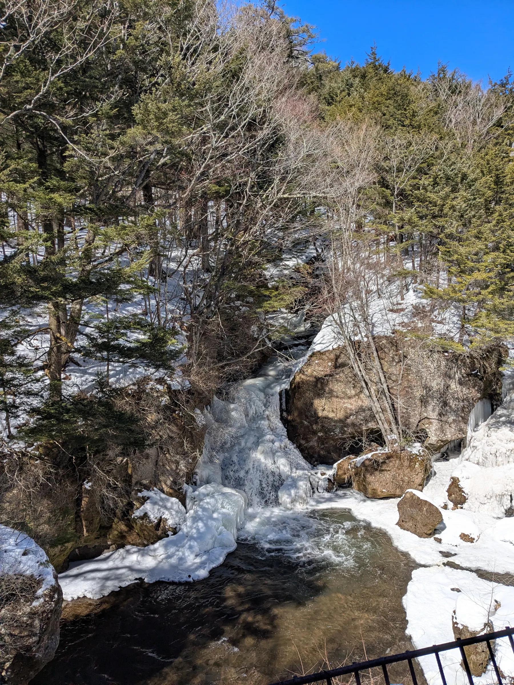 A snowy stream and rocks at Ryūzu Falls in Nikko