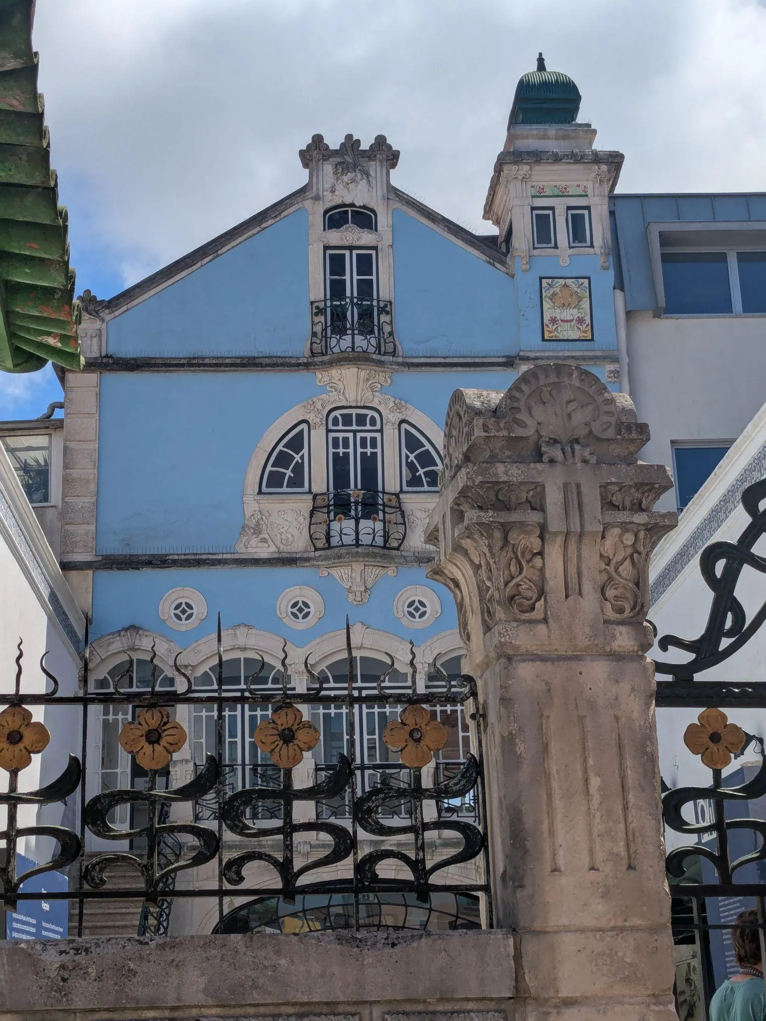 A blue tiled building with decorative details in Aveiro