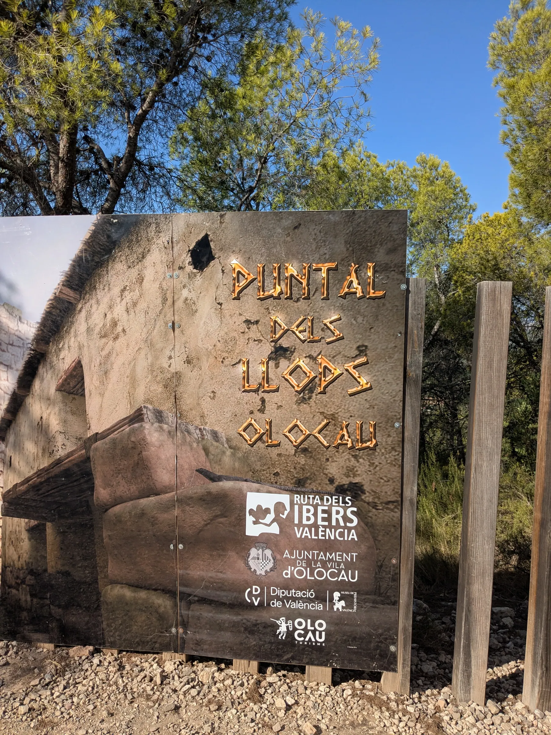 Puntal dels Llops site sign against the blue sky