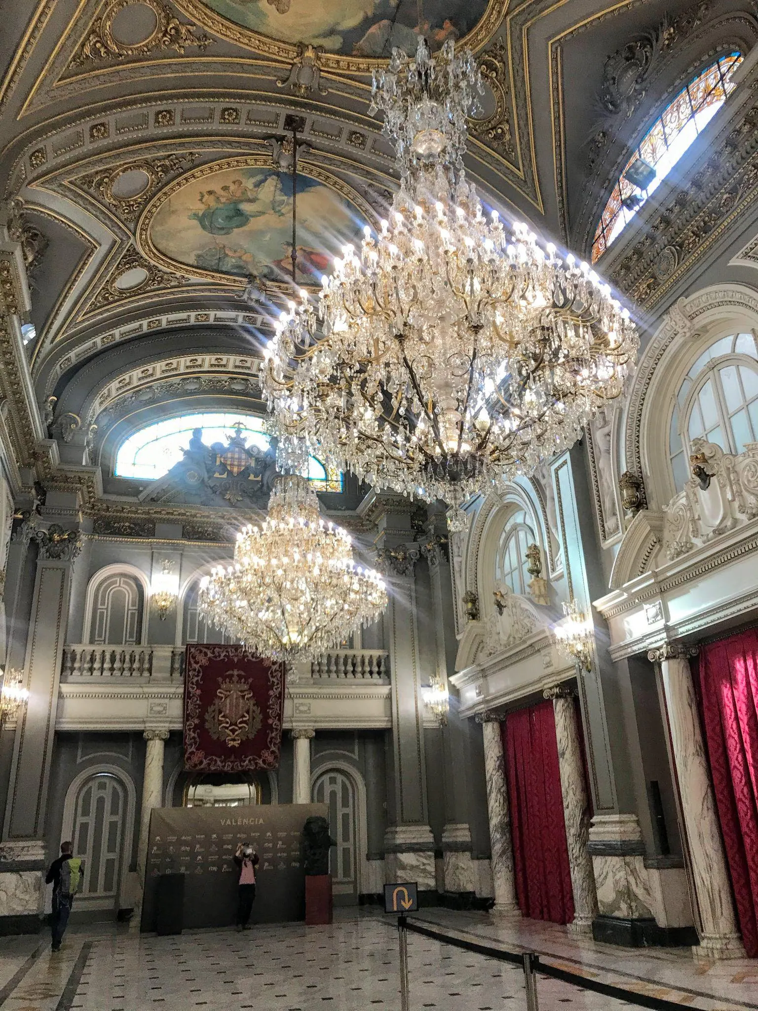 Grand marble staircase and classical vaulted hallway inside Ayuntamiento de Valencia