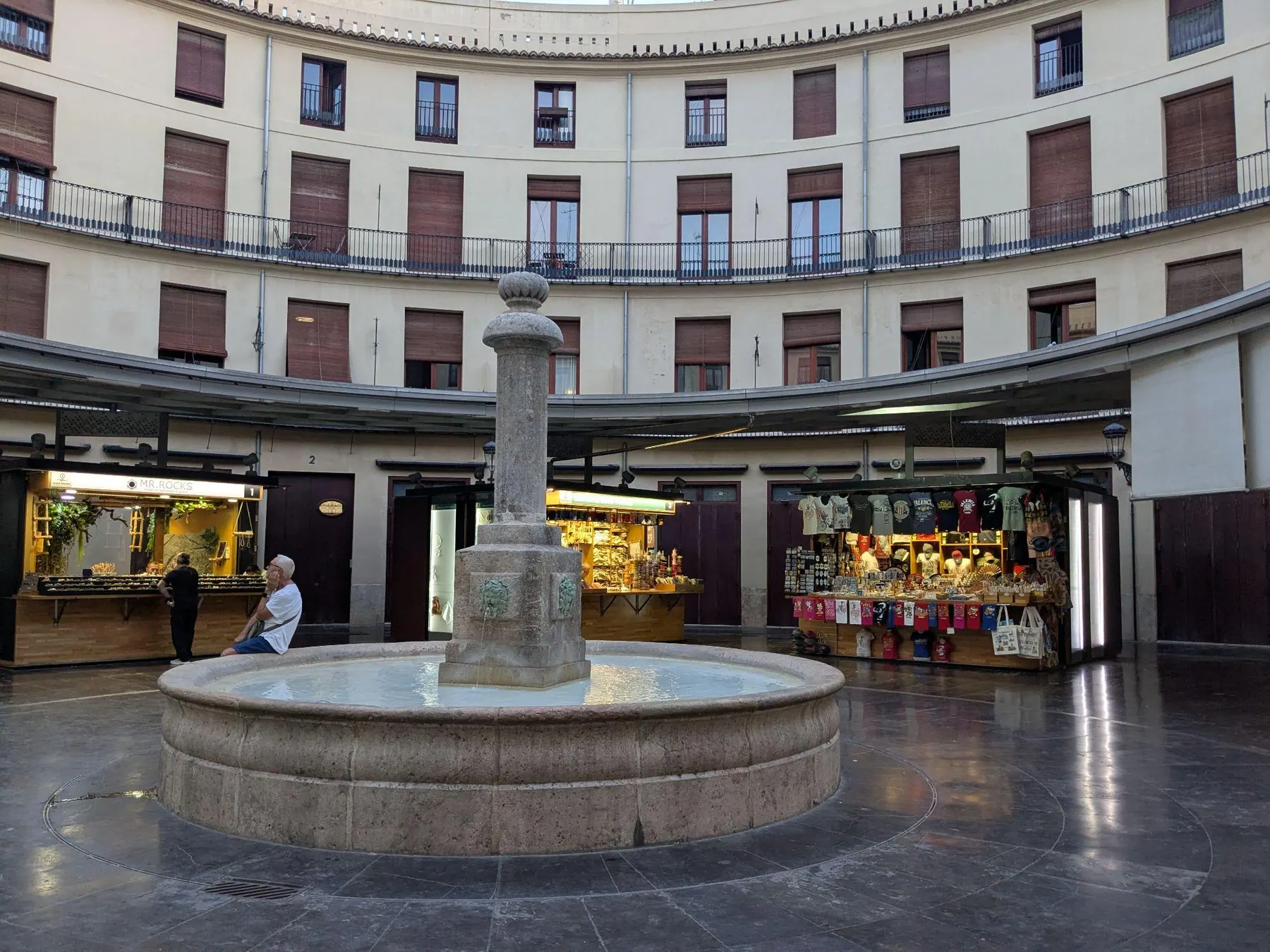 Circular open-air pedestrian plaza surrounded by multi-story townhouses at Plaza Redonda