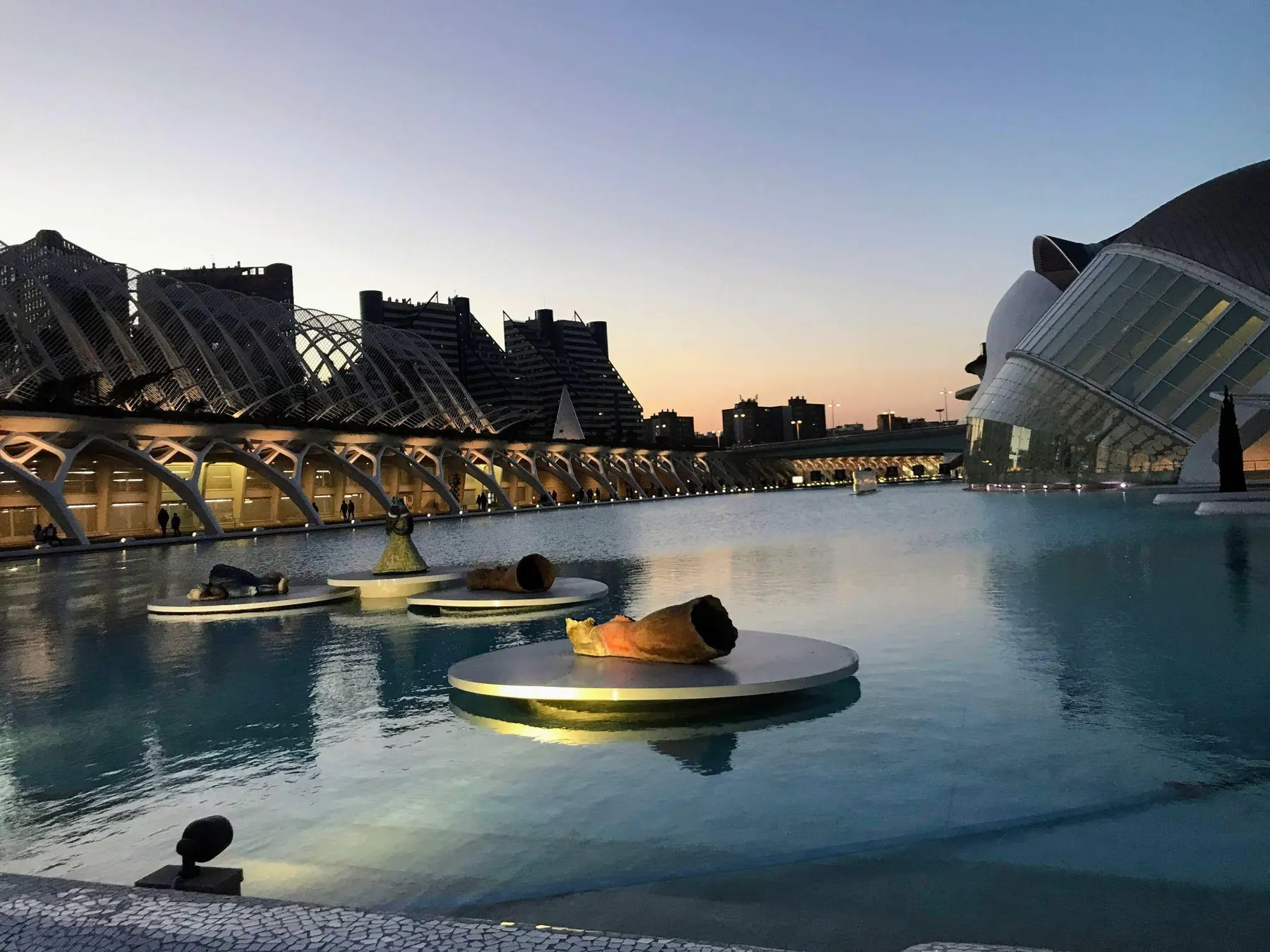 Panoramic vista over the reflecting pools and white curved structures of Ciudad de las Artes y las Ciencias