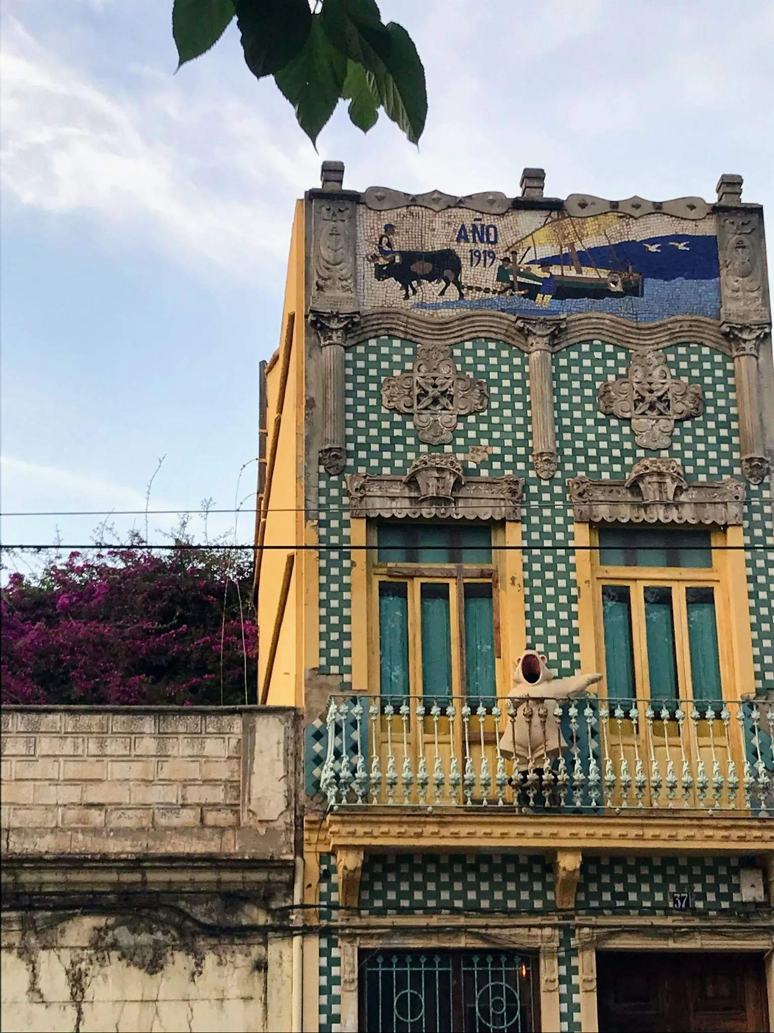 Traditional tiled two-story maritime cottage facade in the historic fishermen quarter of El Cabanyal