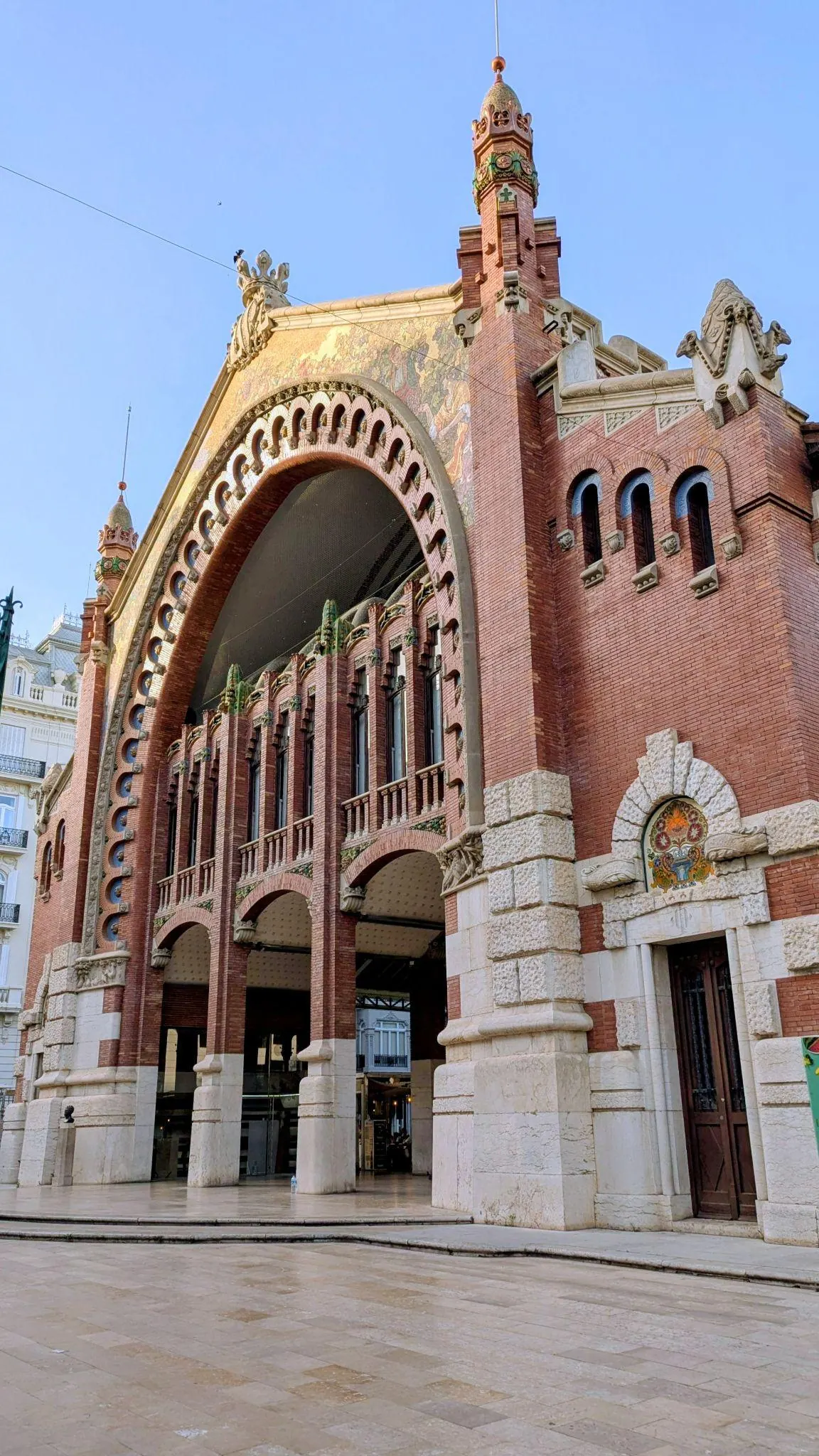 Art Nouveau red brick and mosaic entrance facade of Mercado de Colón